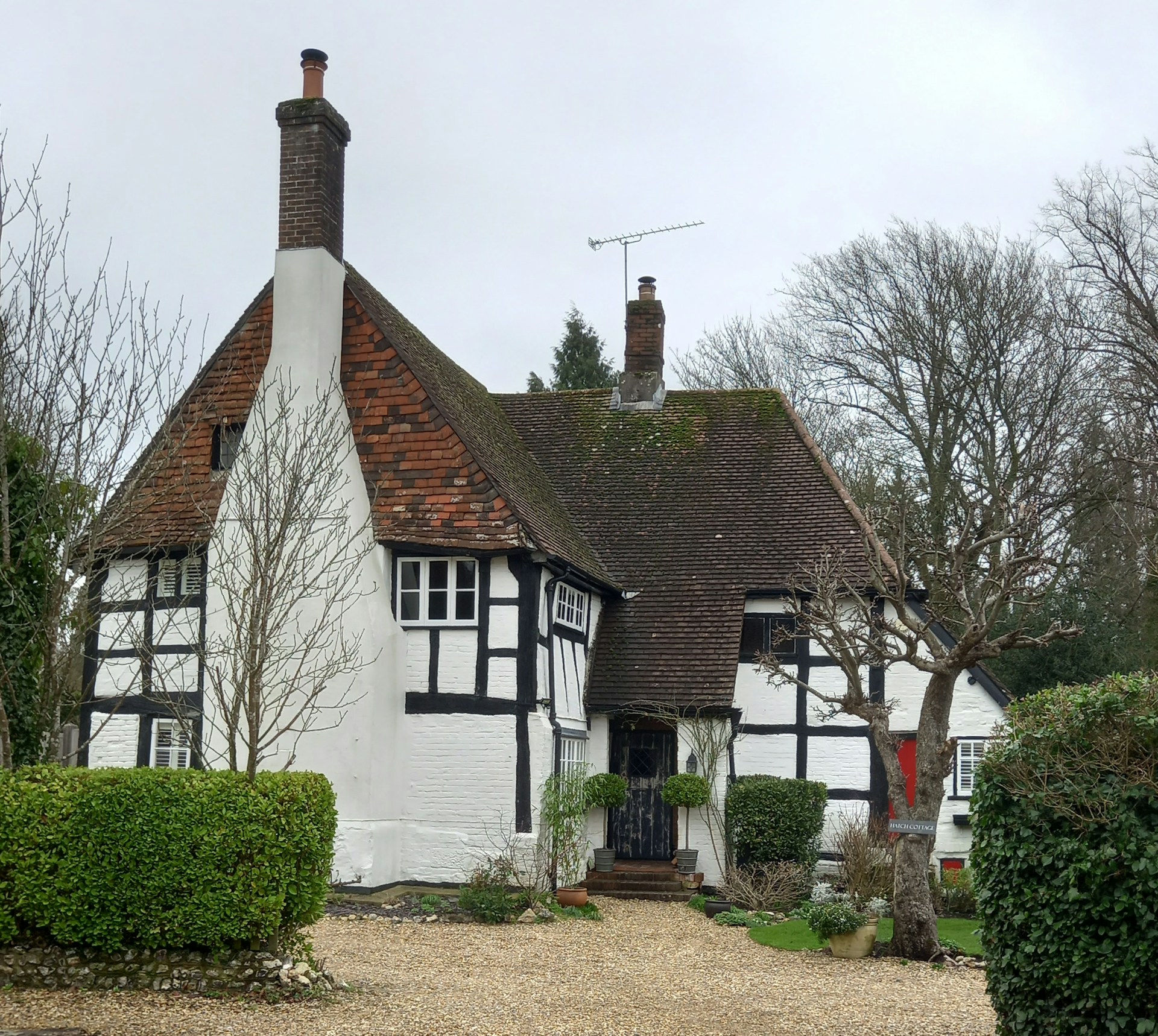 Tudor-style home with brick chimneys