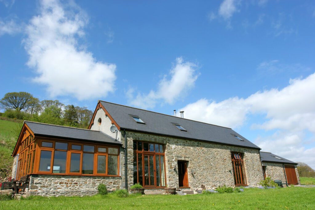 Stone barn repurposed into barn home