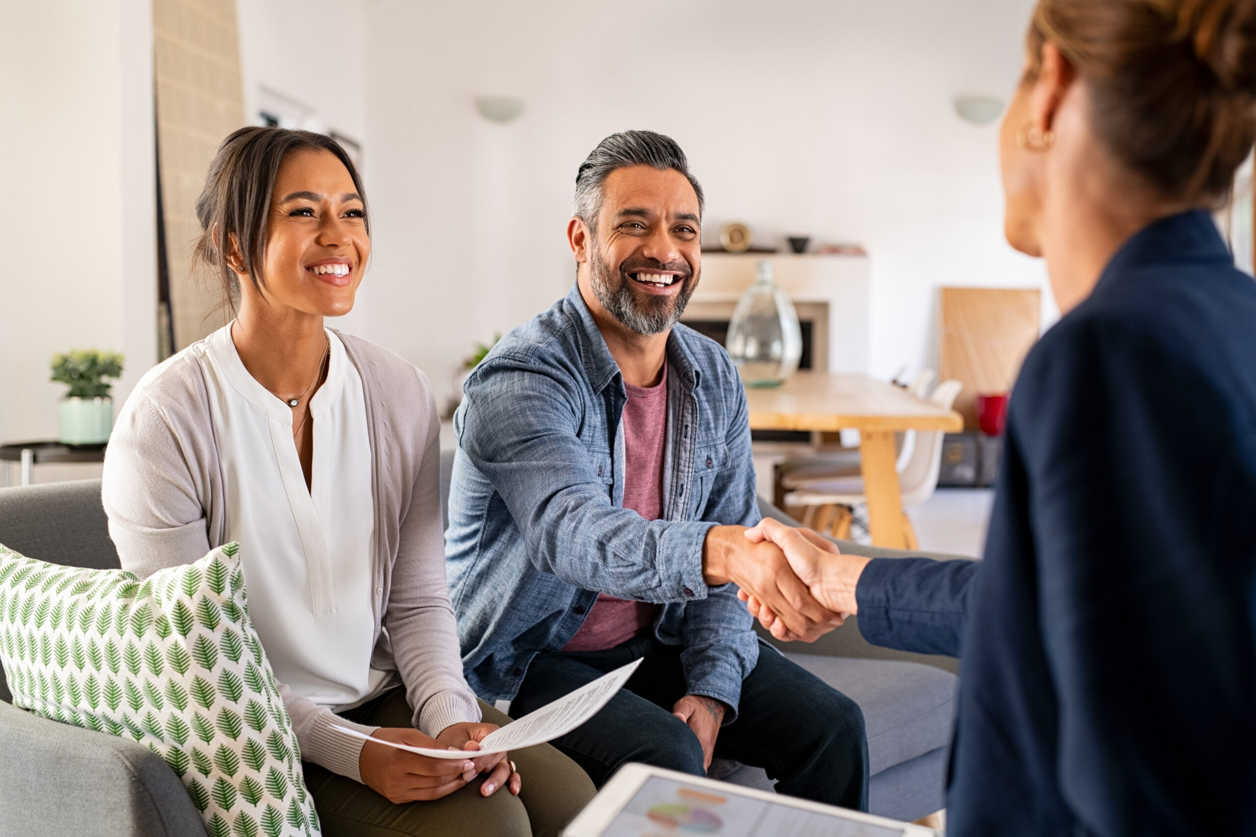 Multiethnic couple exploring a mortgage refinance