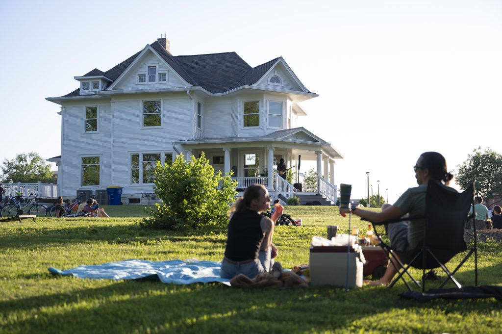Man and woman watching a concert at the Ranshaw House Concert Series in Iowa City