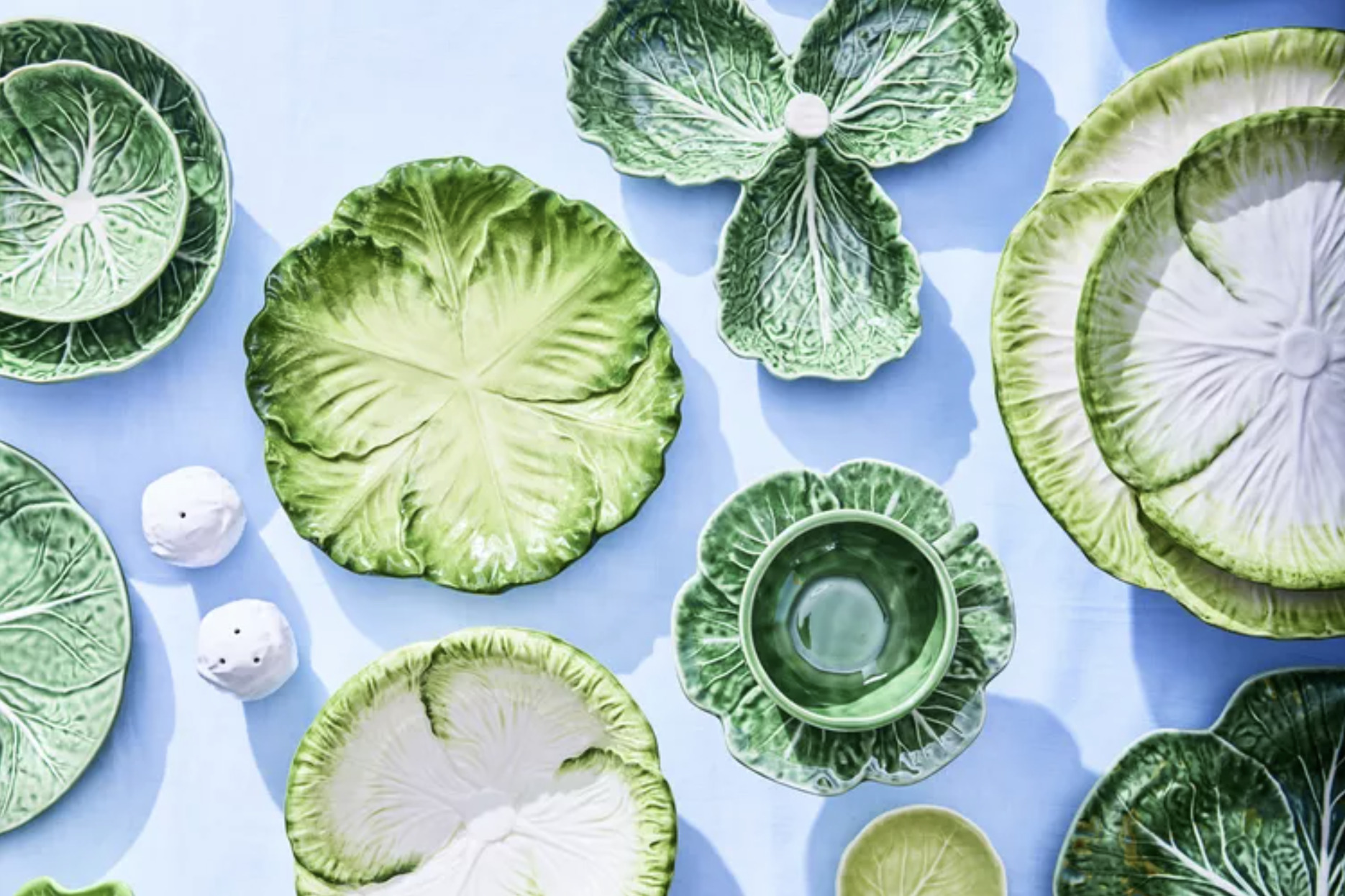 Cabbageware dishes on a blue table setting