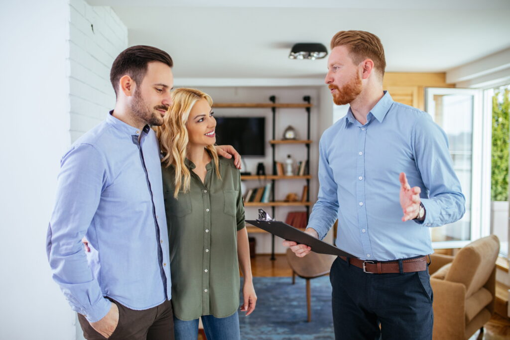 Young couple with inspector in their home