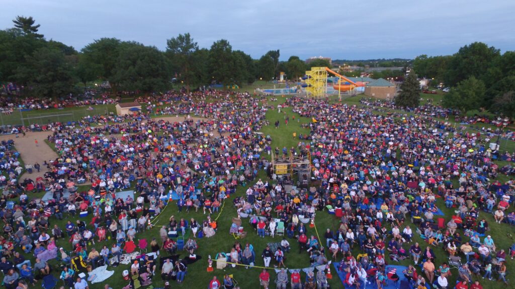 People attending the Coralville 4thFest Concert in S.T. Morrison Park in Coralville, Iowa