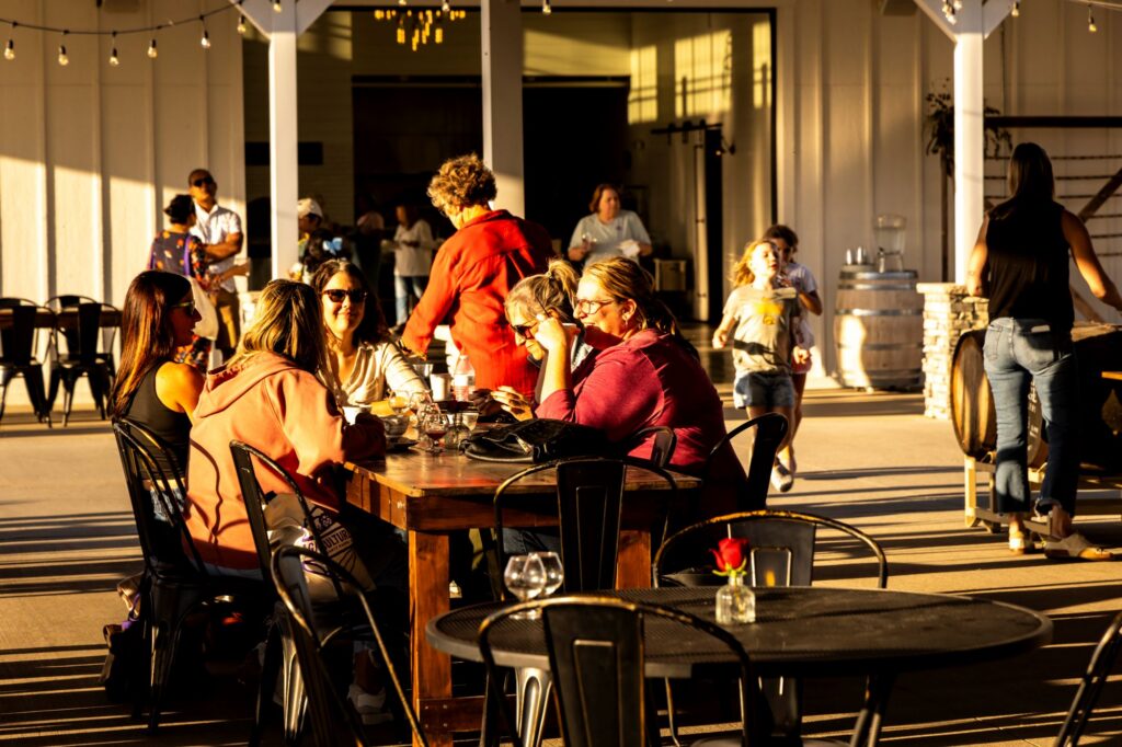 Diners enjoying conversation at Walker Homestead