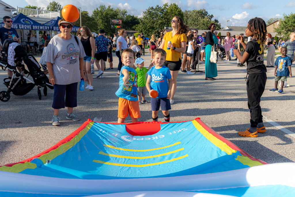 Children playing a game at the North Liberty Community Block Party and Street Dance in North Liberty, Iowa