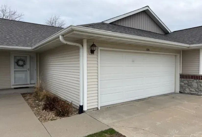 Exterior entry & garage.