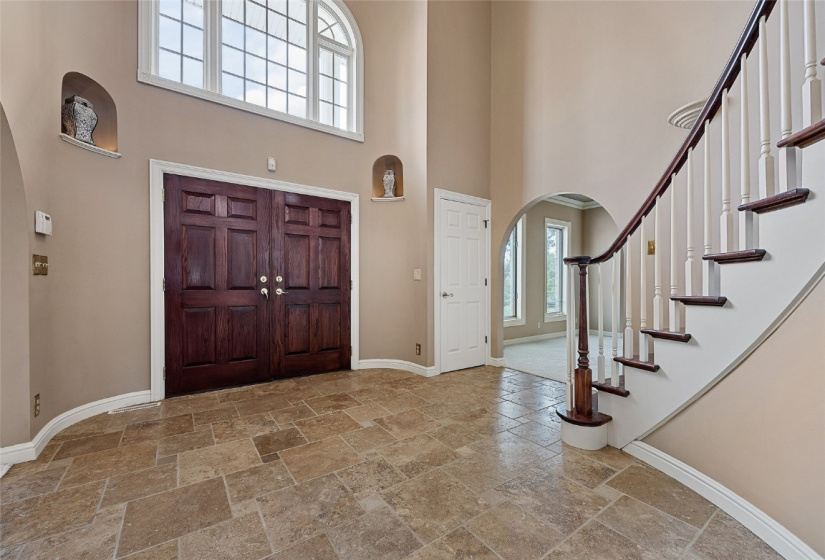Front Foyer to Second Level With Curved Staircase