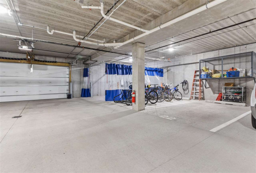 Parking space for this unit features a storage cage and is conveniently near the car wash bay