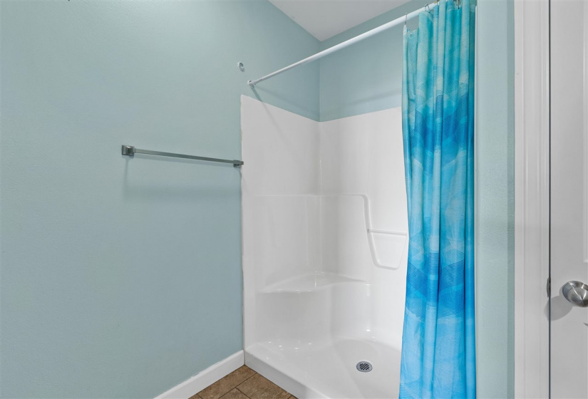 Large shower stall in private full bathroom of primary bedroom.