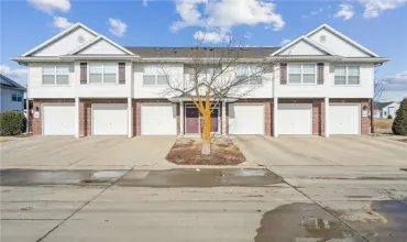 Great curb appeal!  Condo No-Steps Entry Door is on Left Side of Building, Easy Access!  Overhead Garage Door is 2nd from left.